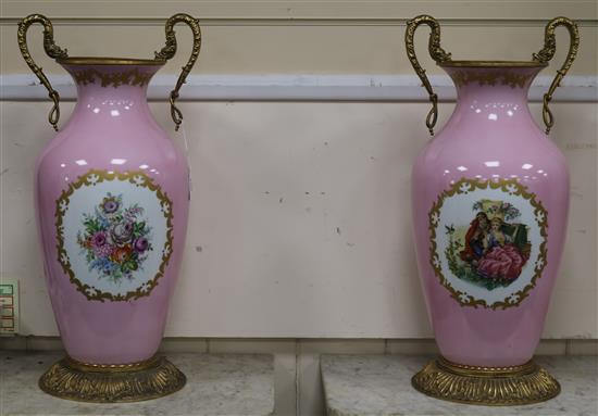 A pair of large Limoges pink ground vases height 62cm